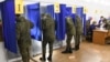 Servicemen vote in the 2021 Russian parliamentary election at polling station No 202 at secondary school No 10 in the village of Peschanka